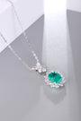 This S925 sterling silver necklace has a delicate design. Oval emerald with diamond halo, vibrant green, classic shape.