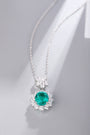 S925 silver necklace with a unique design. Oval emerald with diamond accents, deep green, graceful shape.