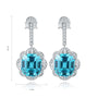 S925 silver earrings, sturdy clasp. Simple halo design with a lake - blue lab - grown cobalt spinel, round shape stands out.