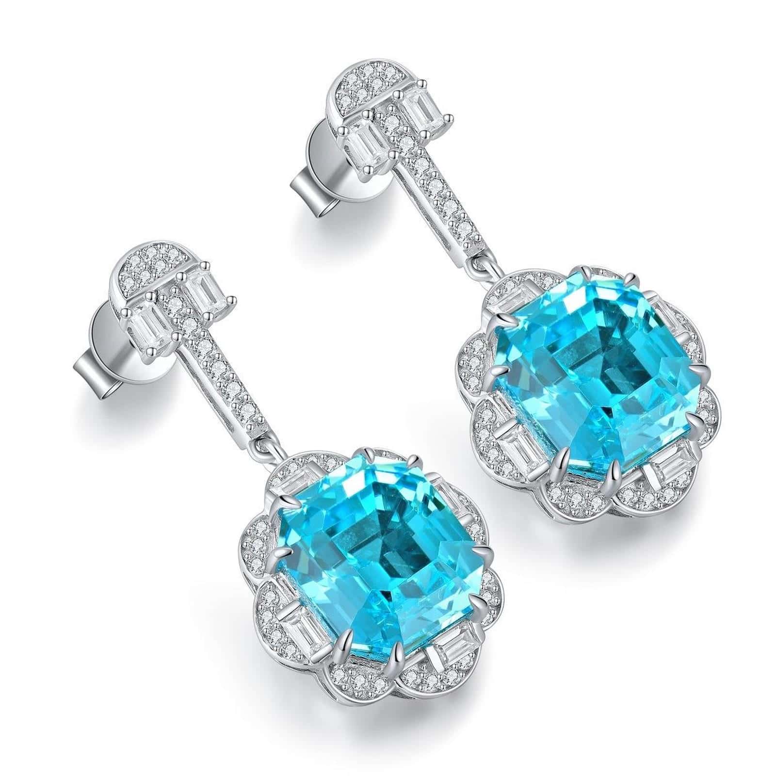 These S925 silver earrings have a practical clasp. Lake - blue gem in halo setting, serene color, nice round form.