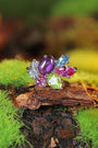 The ring surface is set with colored gemstones such as amethyst, featuring rich and gorgeous colors.