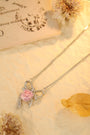 This S925 silver necklace has a bow - shaped pendant. Pink lab - grown diamond inlaid, sweet color, lovely form.