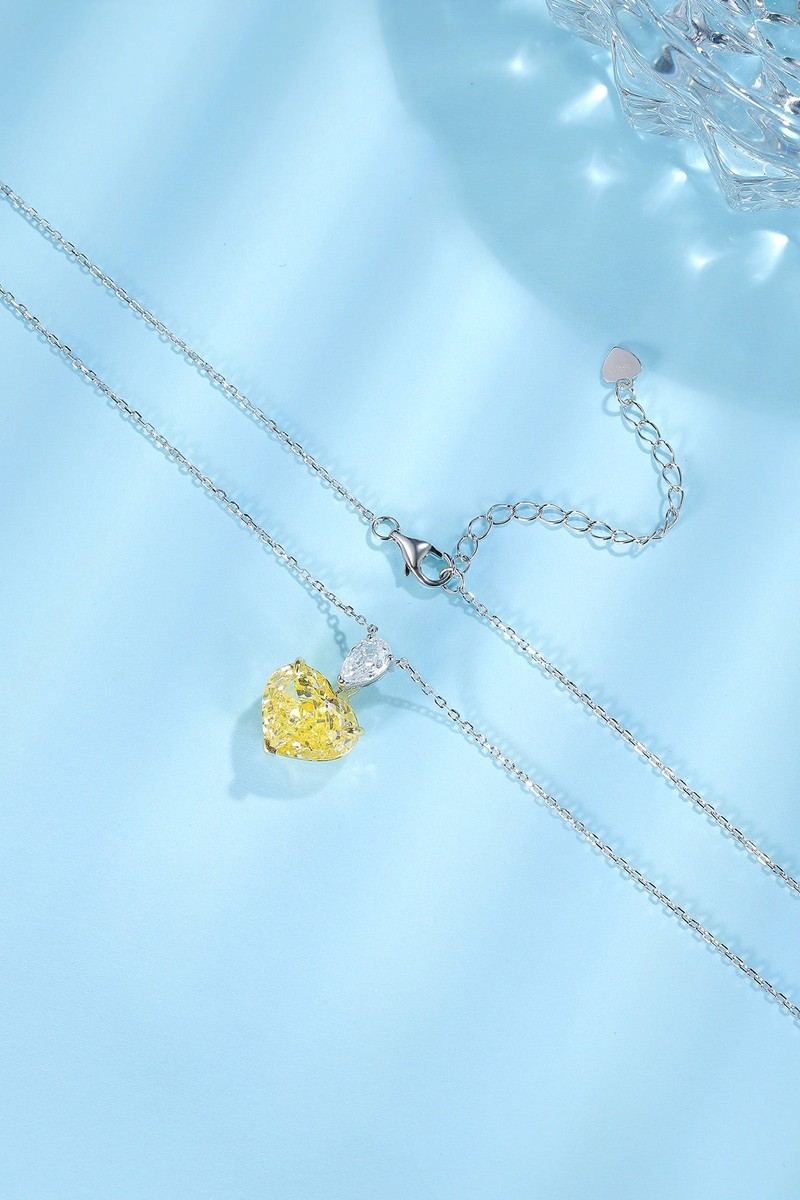 S925 silver necklace with elegant chain and clasp. Heart - shaped yellow diamond pendant, vibrant color, charming shape.
