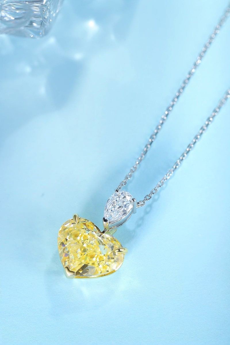 This S925 silver necklace features a heart - shaped pendant. Yellow lab - grown diamonds set, sunny color, lovely shape.