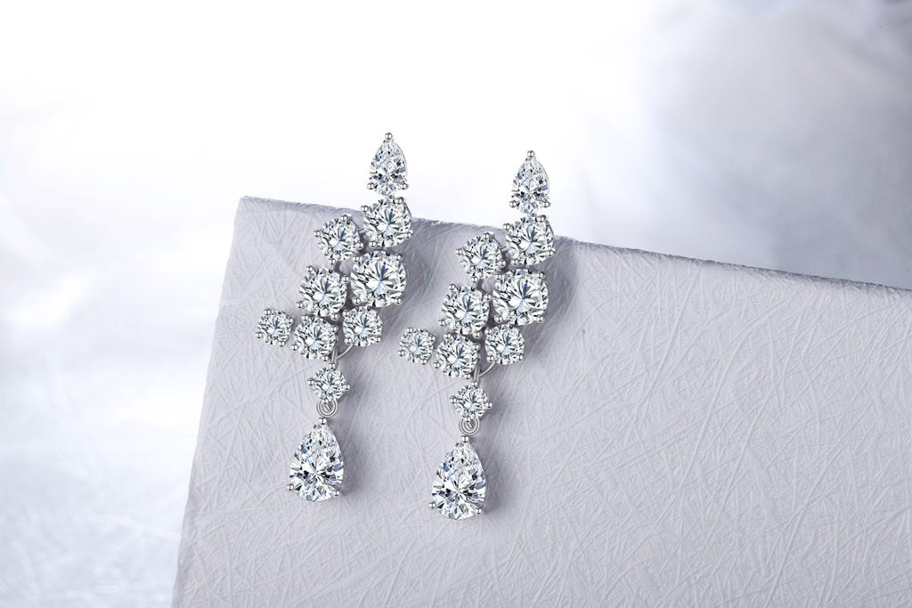 S925 silver studs, practical clasp, clear lab - grown gems, teardrop and round shapes, alluring.