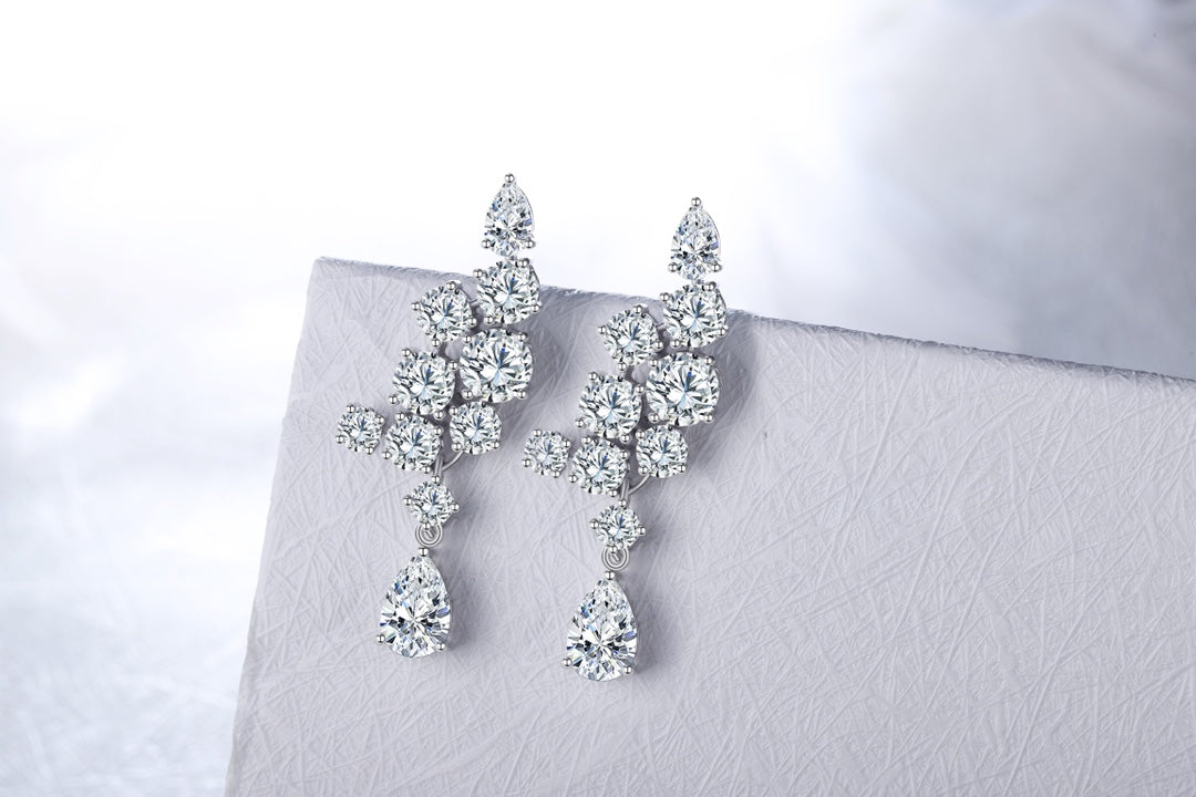 S925 silver studs, practical clasp, clear lab - grown gems, teardrop and round shapes, alluring.