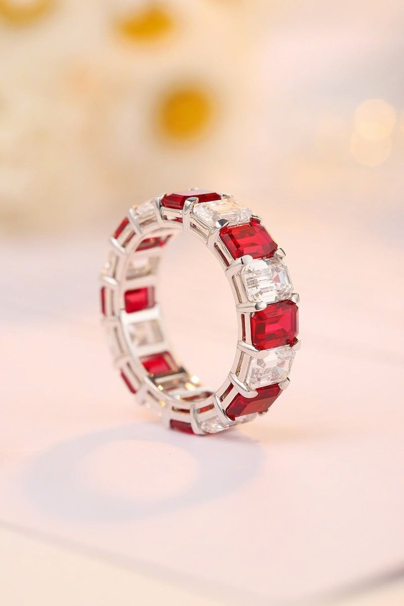S925 silver ring, well-crafted band. Features red rubies and clear stones, circular and elegant shape.
