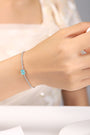 S925 silver bracelet, clasp well - designed. Shows a rectangular blue lab - grown gem on a diamond - studded chain, charming 