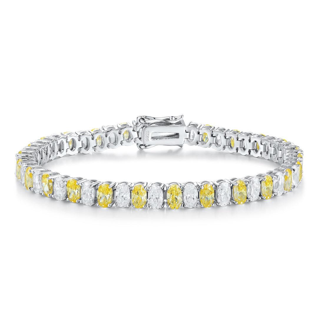 S925 silver bracelet, clasp secure. Features alternating yellow and clear cubic zirconia, oval - like shape in a line.