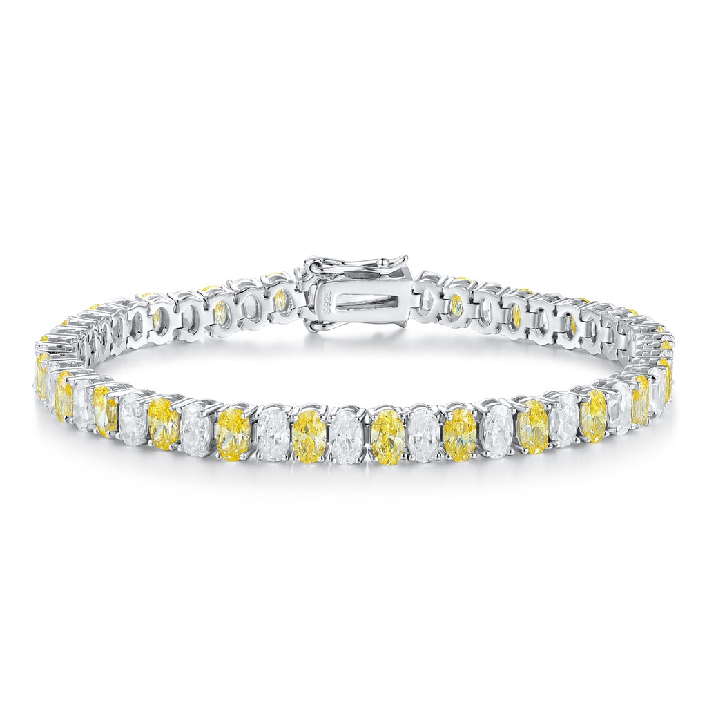 S925 silver bracelet, clasp secure. Features alternating yellow and clear cubic zirconia, oval - like shape in a line.