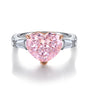 The S925 silver ring with an open design features a delicate setting holding a heart-shaped pink cubic zirconia. It has a sof