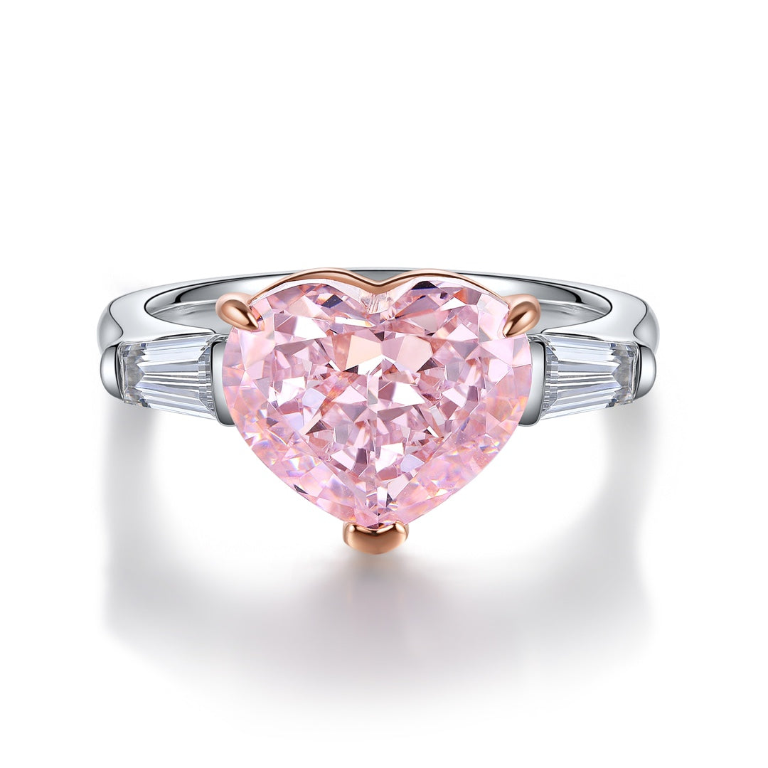 The S925 silver ring with an open design features a delicate setting holding a heart-shaped pink cubic zirconia. It has a sof