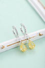 The S925 silver earrings feature a reliable clasp. Clear and yellow cubic zirconia in teardrop shape, lovely design.