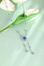 This S925 silver necklace has a practical clasp. Features a floral deep-blue gemstone with dangling diamond details, nice des