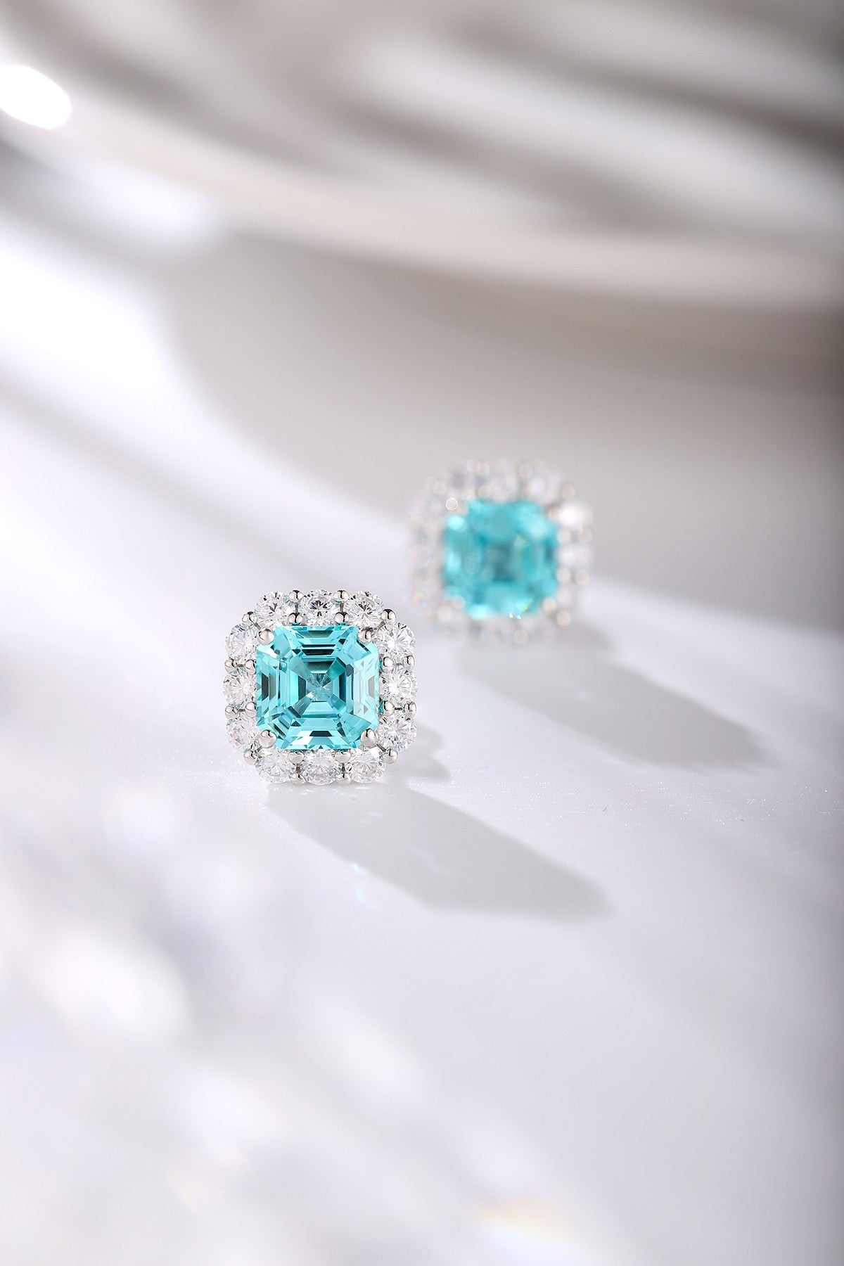 S925 silver studs, fine clasp, square turquoise gems from lab, really appealing.