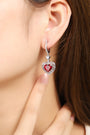 The earrings made of S925 silver have simple and durable ear hook and clasp designs. The lab-grown rubies are heart-shaped wi