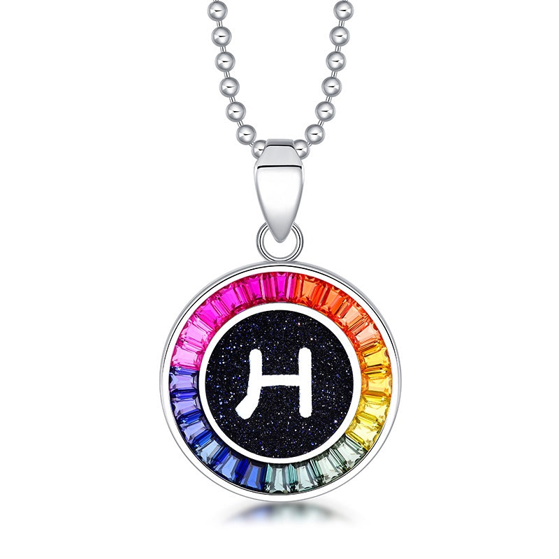 Petite S925 silver necklace, ball - chain design. Features a round "H" pendant, multi - colored with lab - grown sapphires.