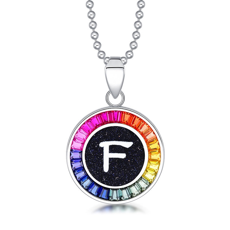 Petite S925 silver necklace, ball - chain design. Features a round "R" pendant, multi - colored with lab - grown sapphires.