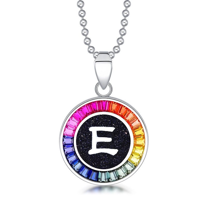 Petite S925 silver necklace, ball - chain design. Features a round "E" pendant, multi - colored with lab - grown sapphires.