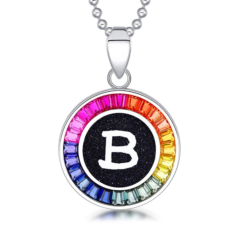 Petite S925 silver necklace, ball - chain design. Features a round "B" pendant, multi - colored with lab - grown sapphires.