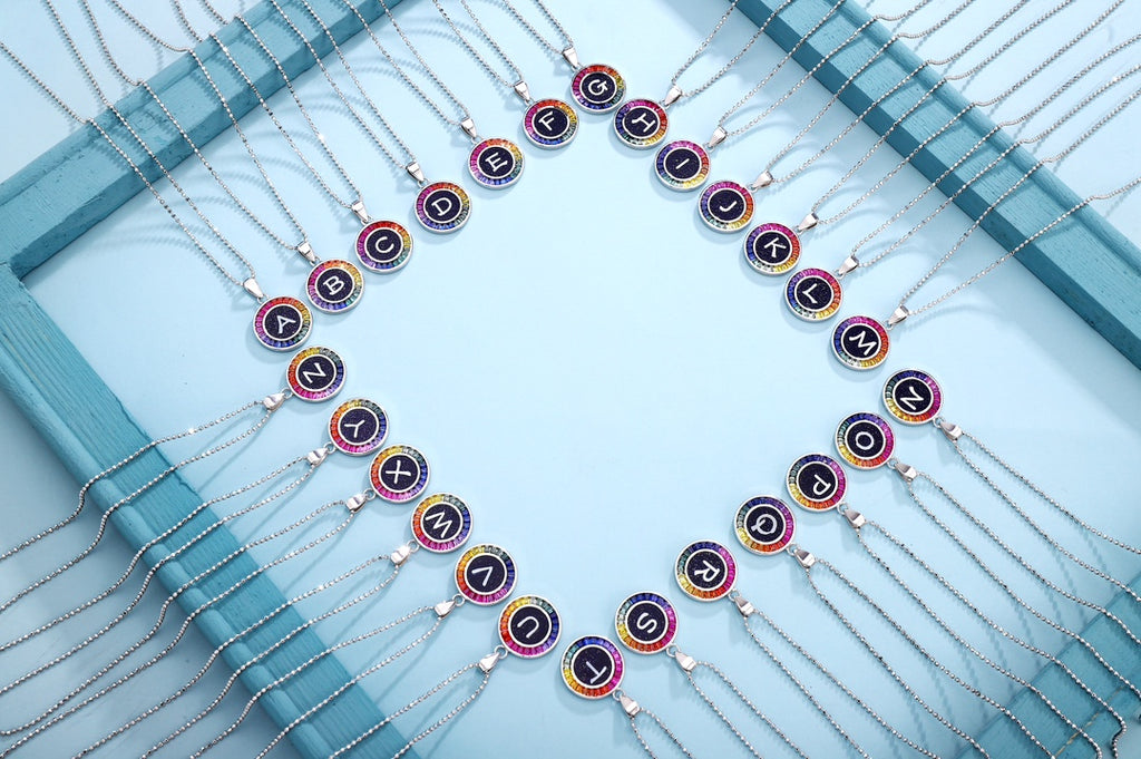 Large S925 silver letter necklace, with delicate chain design. Colorful like rainbow, round shape with letters.