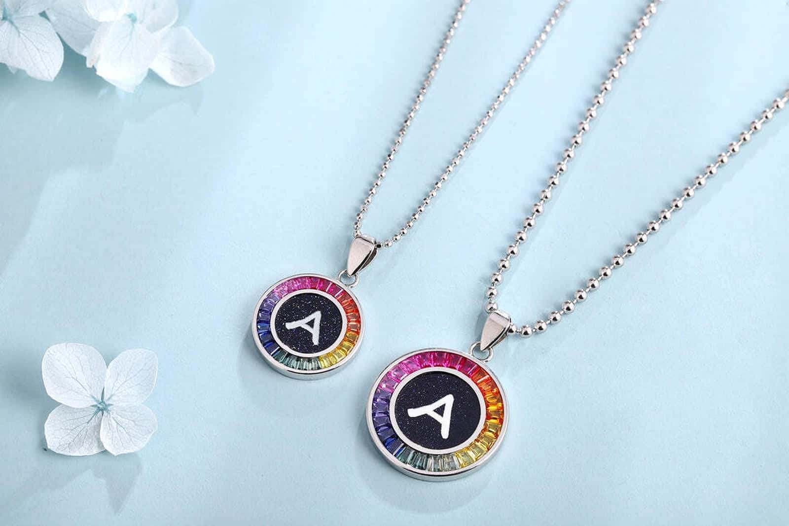 This S925 sterling silver necklace features A-Z letters. Chain design simple, multi-colored, round pendants.