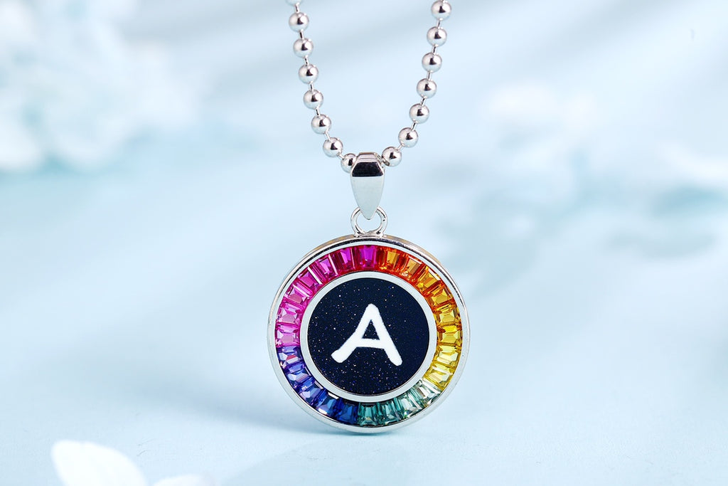Petite S925 silver necklace with letter design. Chain is well-made, multi-hued, round pendants are charming.