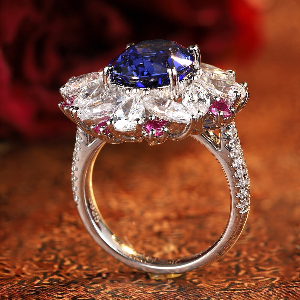 The S925 silver ring has an open design for easy wearing. The main stone is a bright blue lab-grown sapphire, accented by dia