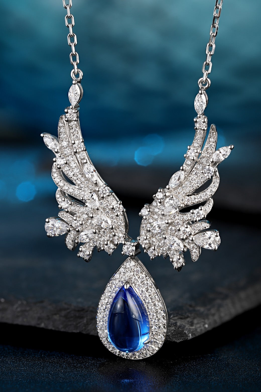 This silver jewelry is made of S925, with a unique clasp and wing design, the teardrop blue stone shines brilliantly.
