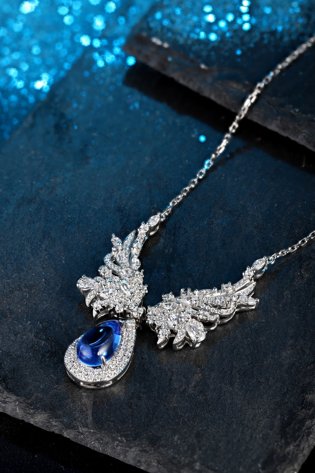 S925 silver with an exquisite clasp, wing-shaped design sets off a teardrop cobalt spinel, the deep blue is eye-catching.