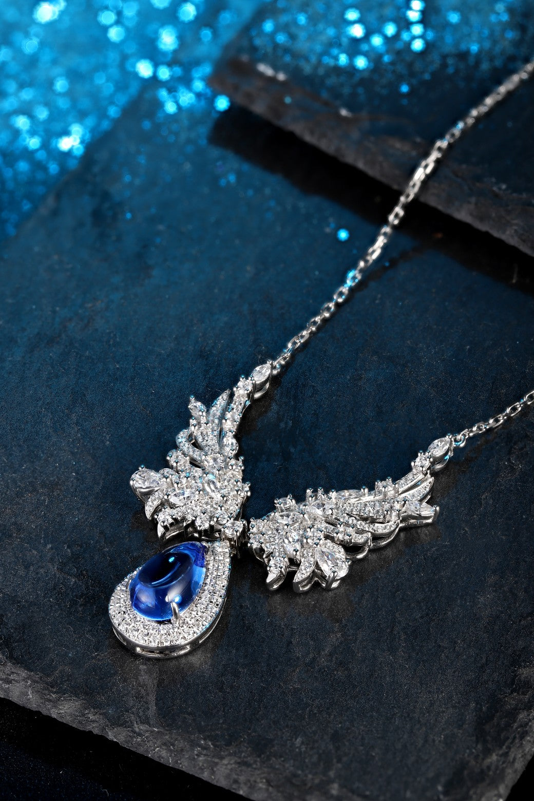 S925 silver with an exquisite clasp, wing-shaped design sets off a teardrop cobalt spinel, the deep blue is eye-catching.
