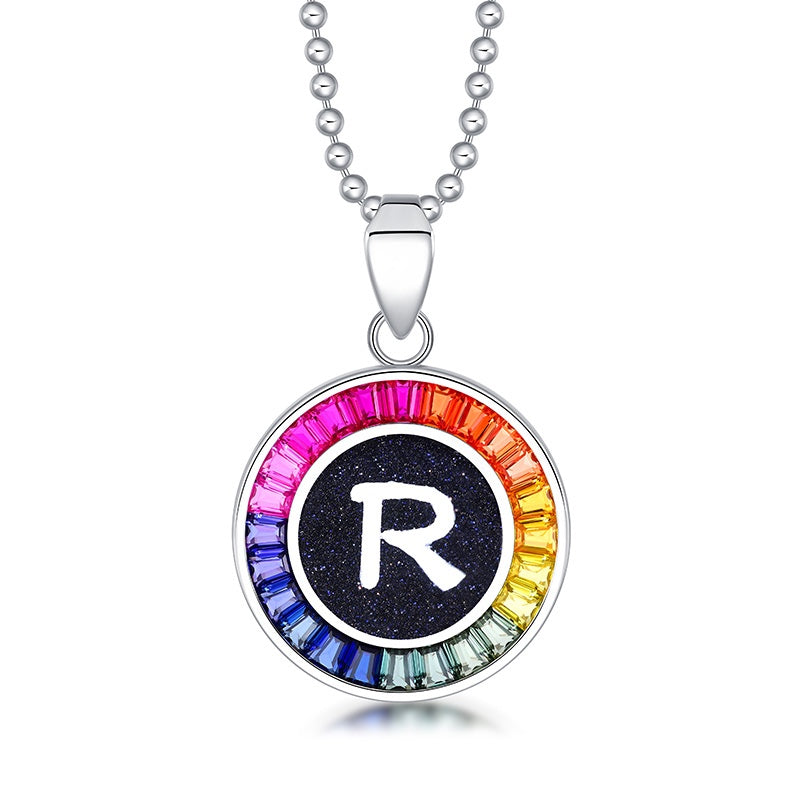 Petite S925 silver necklace, ball - chain design. Features a round "R" pendant, multi - colored with lab - grown sapphires.