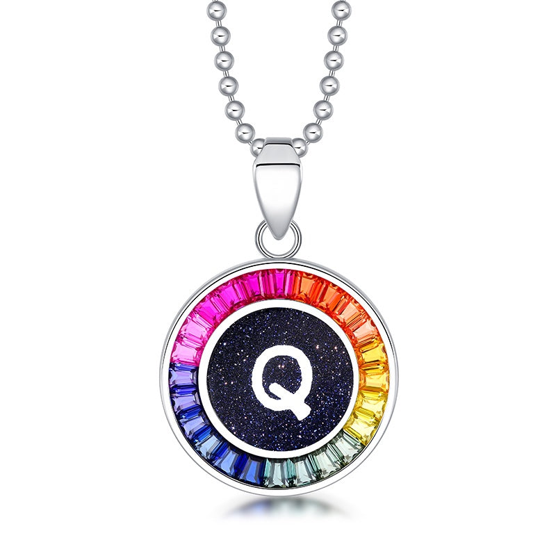 Petite S925 silver necklace, ball - chain design. Features a round "Q" pendant, multi - colored with lab - grown sapphires.