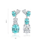 These S925 silver stud earrings are set with turquoise - blue lab - grown Paraíba tourmaline. With a chic clasp design, the 