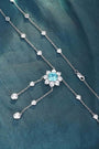 This S925 silver necklace has a secure clasp. Features a floral-designed light blue gemstone with diamond accents, charming s