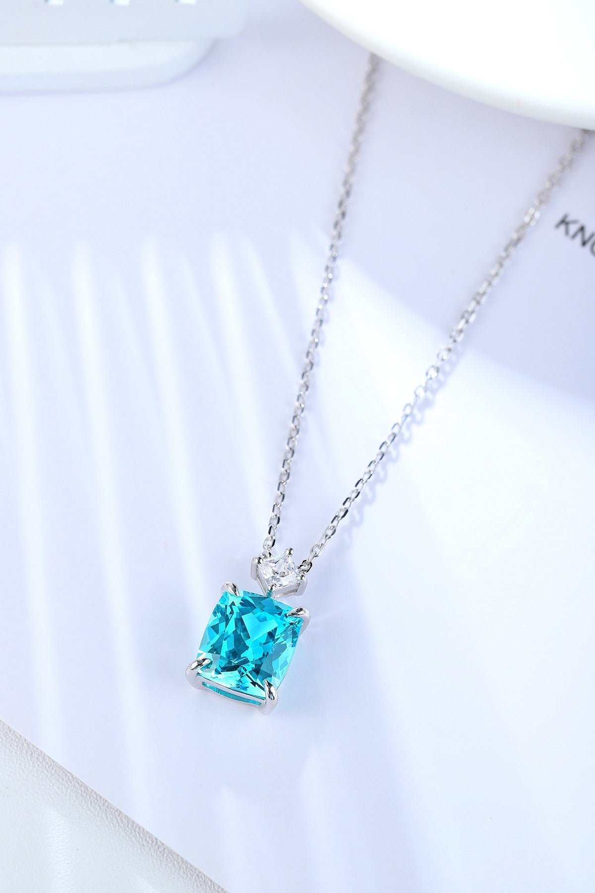 S925 silver necklace with practical clasp. Square electric - blue lab - grown Paraíba tourmaline and a tiny diamond, stylish