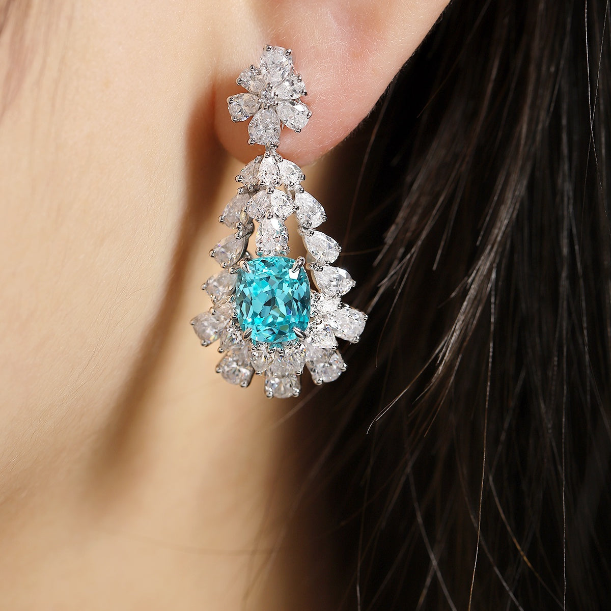 S925 silver stud earrings, dependable clasp. Lake-blue lab-grown diamond in floral motif, serene color, graceful teardrop sha