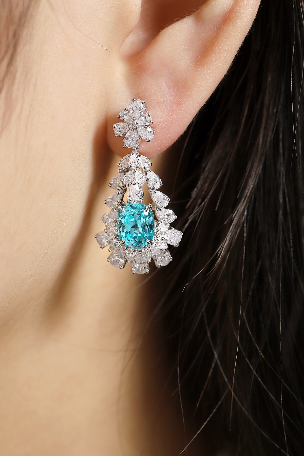 S925 silver stud earrings, dependable clasp. Lake-blue lab-grown diamond in floral motif, serene color, graceful teardrop sha