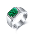 S925 silver open-end ring, with claw setting holding rectangular lab-grown emerald. Fresh green color, shape is classic.