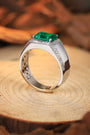 Open-end S925 silver ring, claw-setting inlays rectangular emerald. Deep green, simple shape shows elegance.