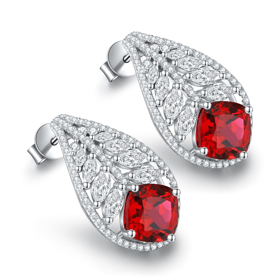 These stud earrings are made of S925 silver with practical and secure ear backs. The main stones are vivid lab-grown rubies, 