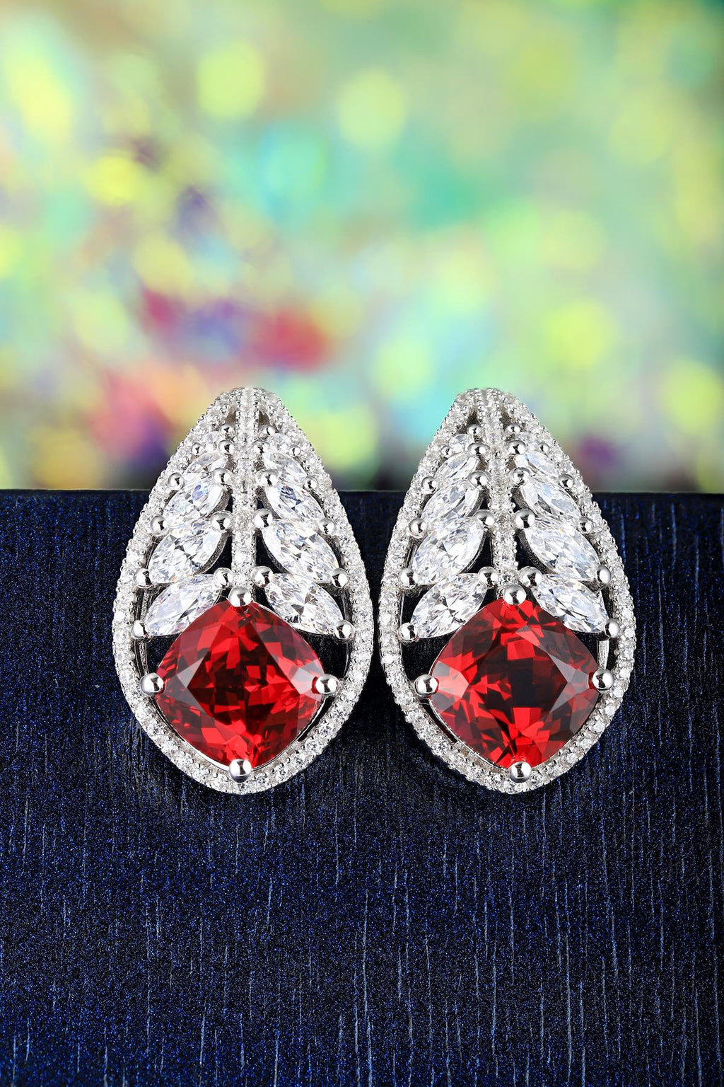 This pair of stud earrings uses S925 silver with a reasonable and secure ear back design. The vivid lab-grown rubies are at t