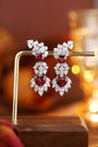 This pair of stud earrings is crafted from S925 silver with reliable and easy-to-wear ear clasps. The deep-red heart-shaped n