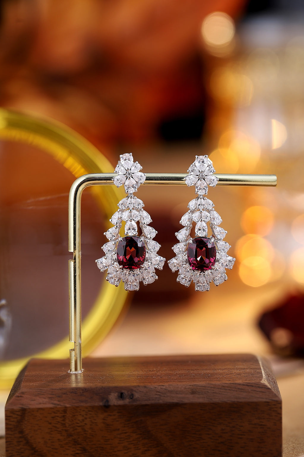 These S925 silver earrings have a well - crafted clasp. Deep - red gem in floral design, intense color, elegant teardrop form