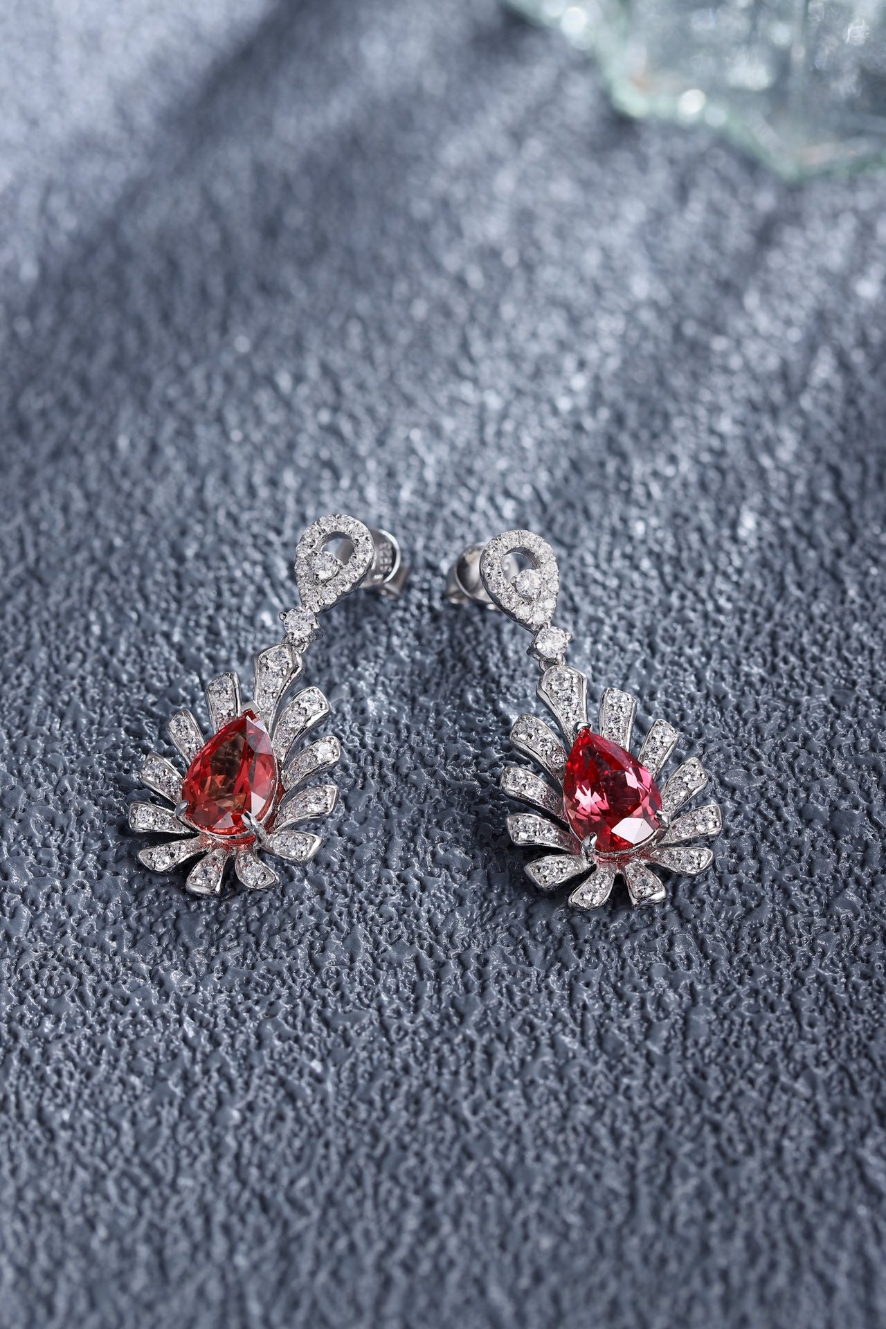 This pair of earrings is crafted from S925 silver with secure and reliable ear hook designs. The gorgeous lab-grown padparads