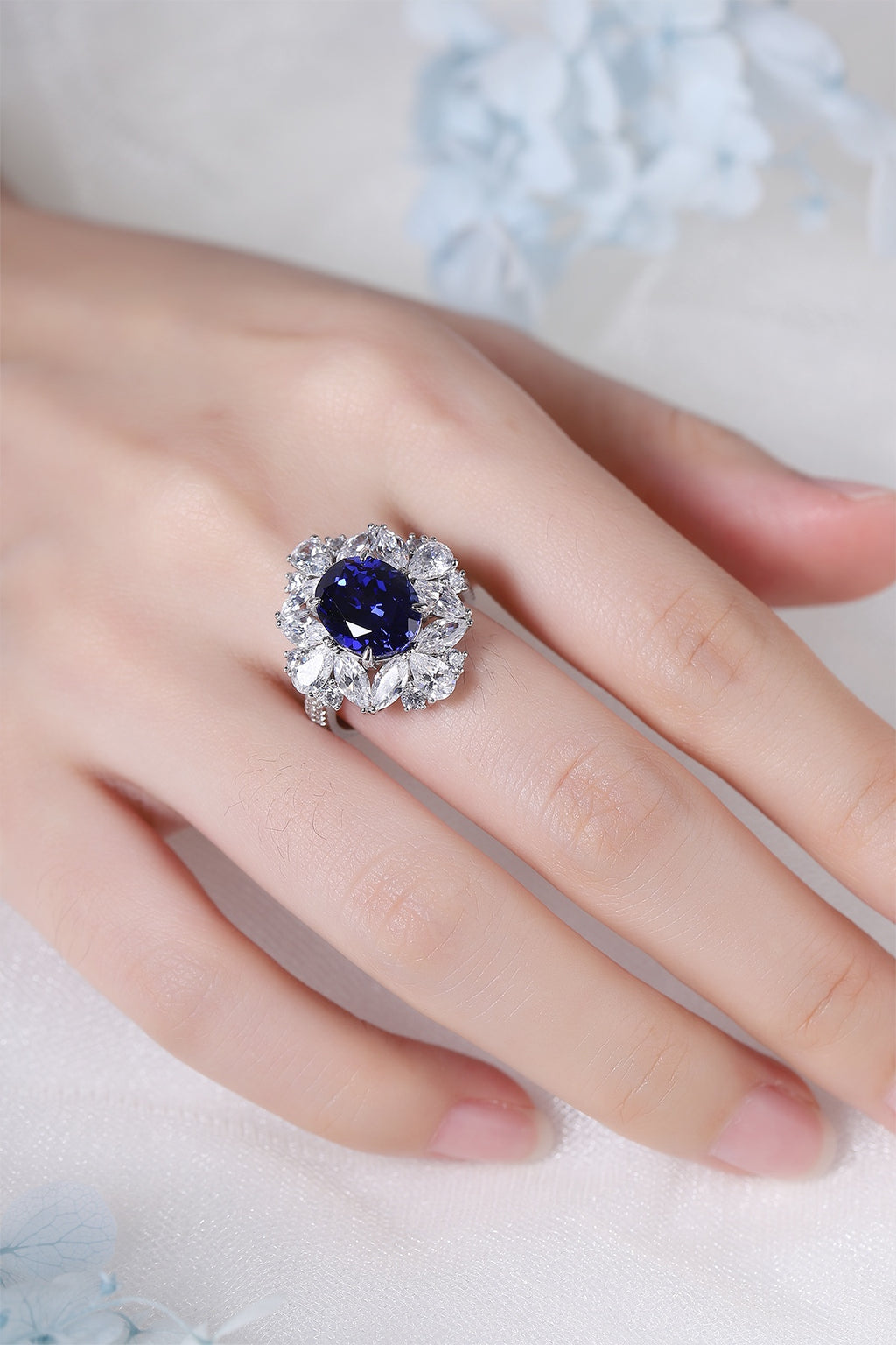This ring is made of S925 silver with a shank that fits the finger. The blue lab-grown sapphire main stone is eye-catching, i