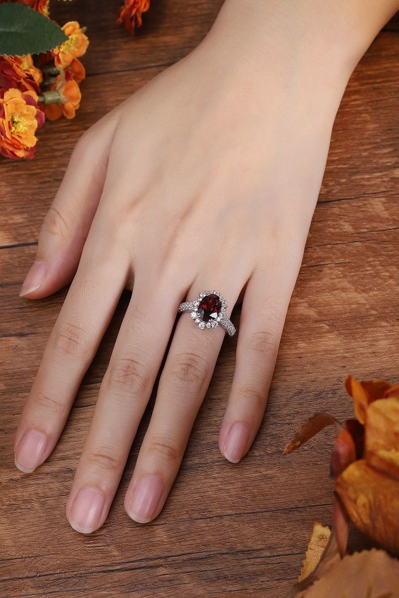 This S925 silver ring has an opening. Deep - red garnet encircled by diamonds, oval gem, easy to wear.