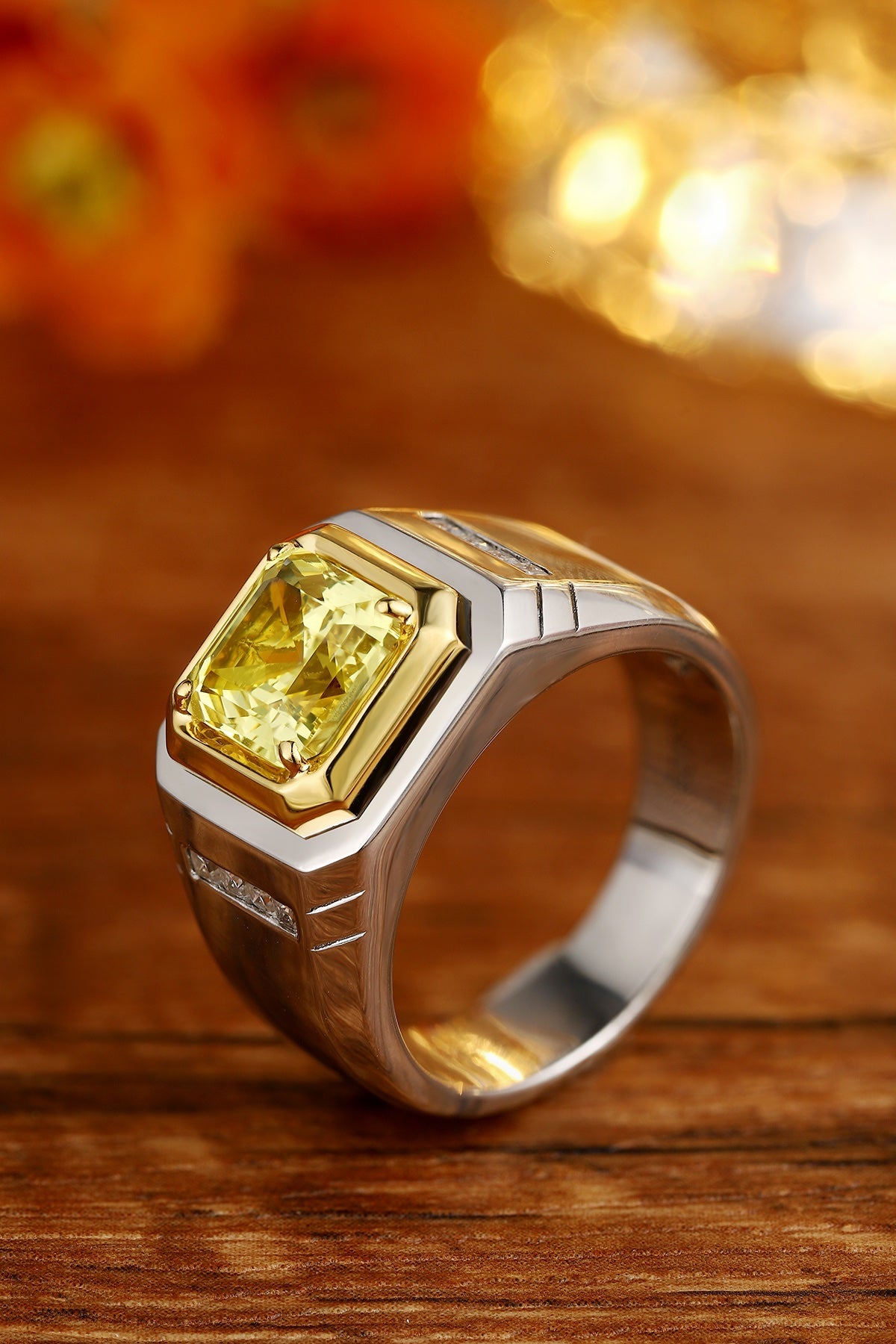 This S925 silver ring has a fine structure. Yellow lab - grown diamond in gold on silver band, square form, vivid hue.