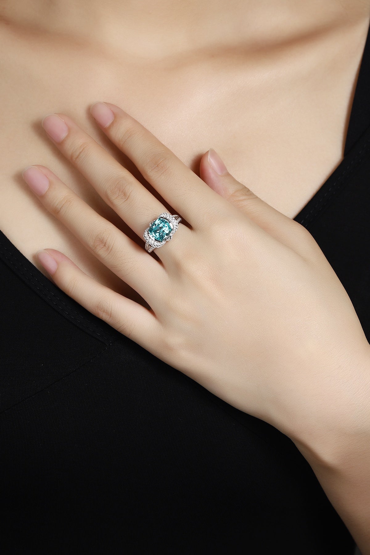 This S925 silver ring features an opening. Turquoise lab-created Paraiba tourmaline encircled by diamonds, oval gem, easy to 