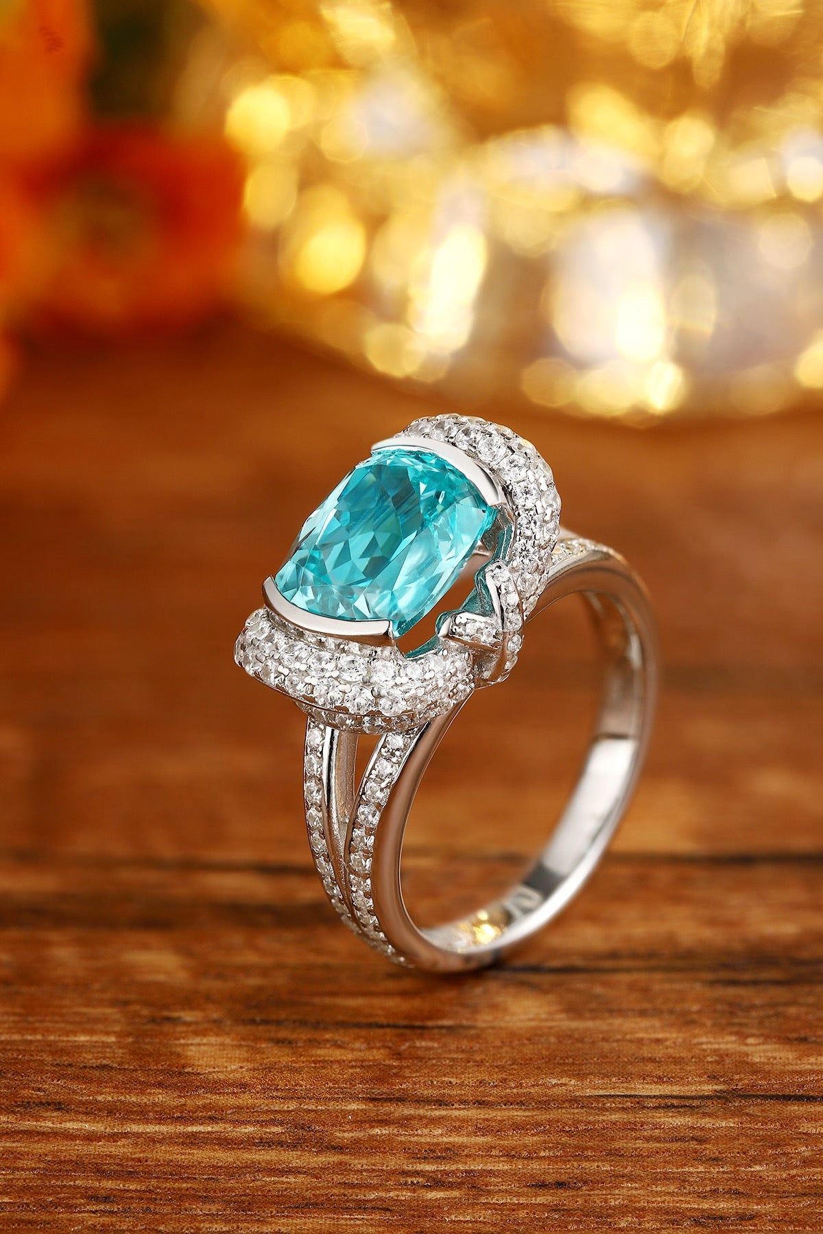 S925 silver ring with adjustable opening. Shows an oval turquoise lab-created Paraiba tourmaline with diamond setting, stylis